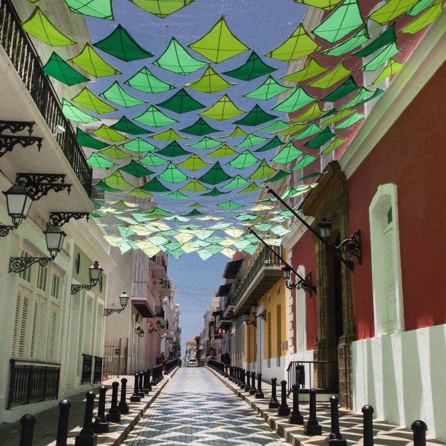 Green kites hang over Fortaleza Street in Old San Juan